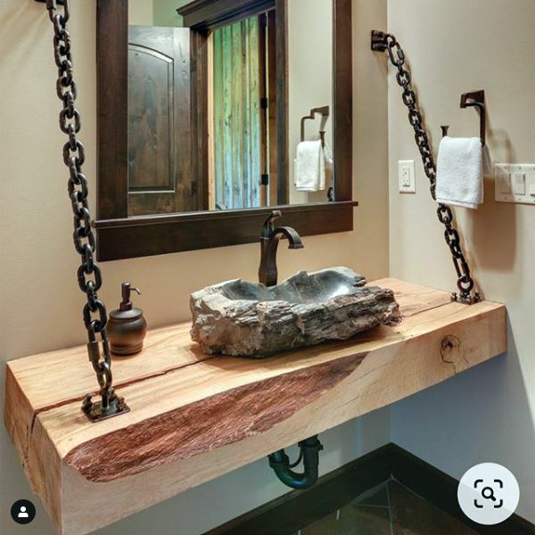 Who knew tractor chains and beams could look so good in the bathroom.